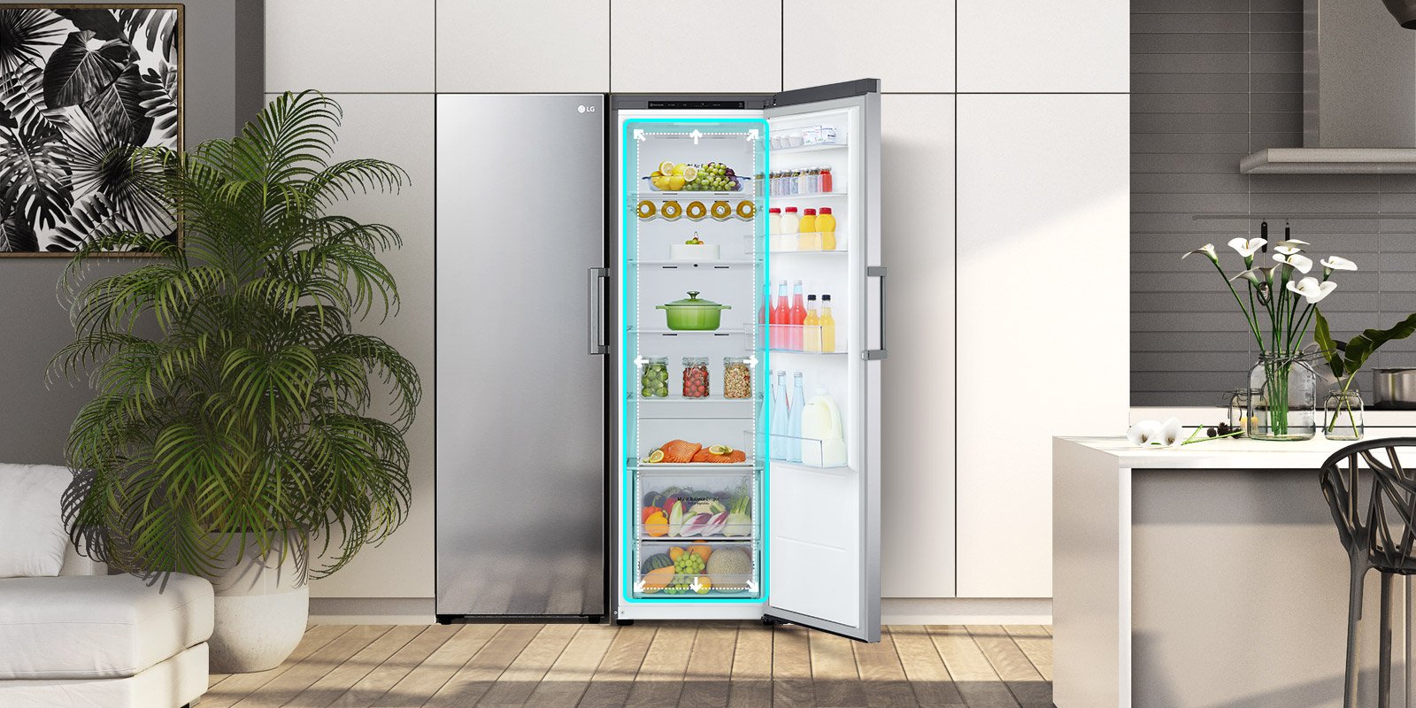 The front view of the fridge is shown in a kitchen with the door open and displaying the produce inside. A blue square highlights the interior with arrows pushing out to indicate there is ample room inside.